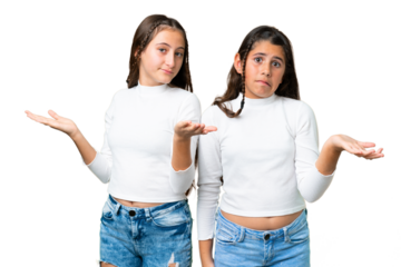 Friends girls holding gift and a birthday cake over isolated chroma key background unhappy and frustrated with something because not understand something