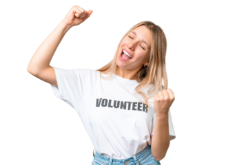Young volunteer woman over isolated chroma key background celebrating a victory