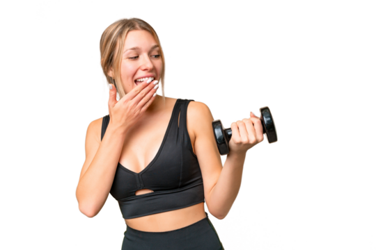 Blonde sport woman making weightlifting over isolated chroma key background with surprise and shocked facial expression