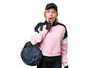 Pretty sport woman with sport bag over isolated chroma key background surprised and shocked while...
