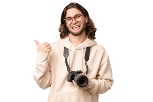 Young photographer man over isolated background pointing to the side to present a product