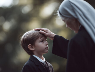 A nun gently places her hand on a young boys head, symbolizing faith, guidance, and generational connection. Suitable for themes of religion, childhood, and care.