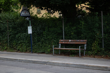 Empty Bus Stop with Wooden Bench