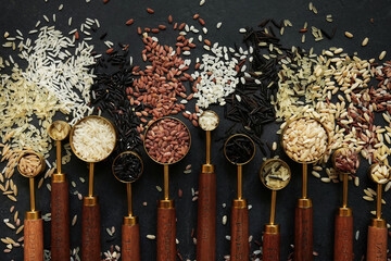 Colorful mix of rice varieties: red and brown, white and wild, black and parboiled, basmati and jasmine. Food ingridients for healthy diet
