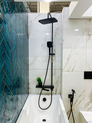 This is a fully equipped bathroom space that includes both a comfortable, relaxing bathtub and a...