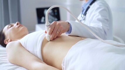 Doctor man, wearing white medical gloves, is using ultrasound equipment on the breast of a female...