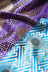 Intricate Patterns on Traditional Ladakhi Fabric in Vibrant Colors