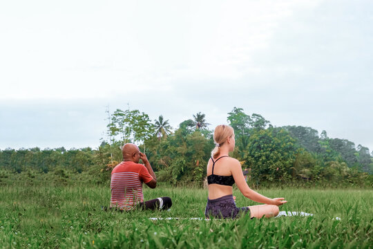 yoga,pranayama,breathing practice.Black afican american man,caucasian woman Meditate,yoga nature,Meditative practice relaxation,retreat,psychedelic journey.Mental health,Mycological refuge,diversity