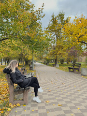 Lonely woman in autumn. mood and seasonal affective disorder concept.