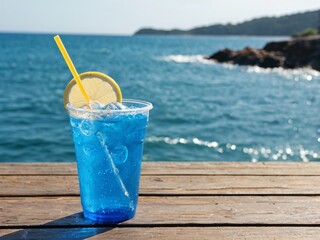 A blue drink on a wooden table at the beach