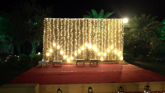 Indian Wedding Stage Decorated for Pooja Ritual with Fairy Lights Backdrop