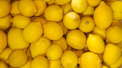 close up of Fresh citrus fruits, lemons top view from the garden and limes pattern background.
