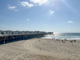 A beach with a pier and a pier with a pier