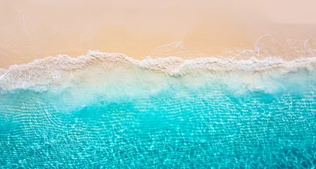 Rugzak Luchtfoto Strand Aerial summer seascape with blue sea water waves crashing sandy beach shore top view from drone tropical ocean pattern bright light Mediterranean coast nature background surf detail sunny marine scene  © icemanphotos