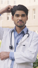 Vertical Photo of Confused Doctor Looking in the Camera