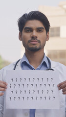 Question Mark, Vertical Photo of Indian Doctor Holding Question Mark Poster