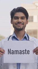 Vertical Photo of Indian Doctor Holding Namste Poster