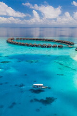 Tranquil aerial view Maldives tropical island water villas turquoise lagoon bay horizon blue sky sunny exotic coast ocean luxury travel summer holiday vacation destination scenic beach wallpaper
