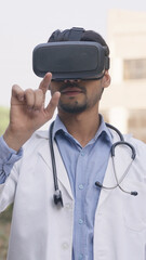 Vertical Photo of Indian Doctor Tapping on VR Screen, Virtual Reality