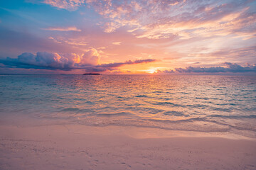 Tranquil summer beach closeup scene with sea sand sky colorful sunset sunlight beautiful seascape natural landscape. Serene relaxing vacation background peaceful coastal nature evening ocean scenic