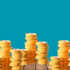 Stacks of golden coins on a wooden surface before blue
