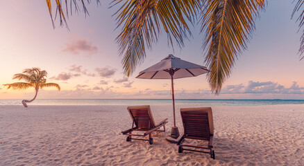 Gorgeous romantic sunset with beach chairs umbrella leisure lifestyle tropical coast summer vacation tourism holiday background palm trees ocean view sky silhouette peaceful nature travel destination