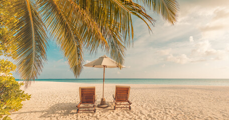 Gorgeous romantic sunset with beach chairs umbrella leisure lifestyle tropical coast summer vacation tourism holiday background palm trees ocean view sky silhouette peaceful nature travel destination