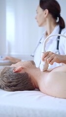 Doctor woman performing neck ultrasound exam on male patient. Medicine service concept