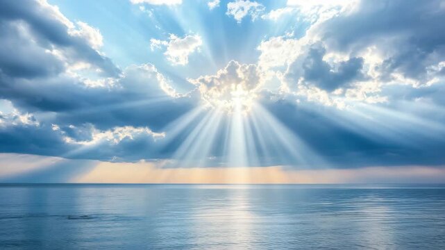 Sunlight and sunbeam breaking through clouds over calm ocean water and sea horizon with soft reflections on water surface creating peaceful sky and inspiring seascape atmosphere