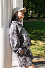 Lonely pensive woman in the park, summer day, close-up
