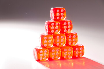 A random arrangement of dice and a puzzle cup, captured after the dice have been cast.