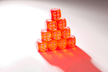 A random arrangement of dice and a puzzle cup, captured after the dice have been cast.