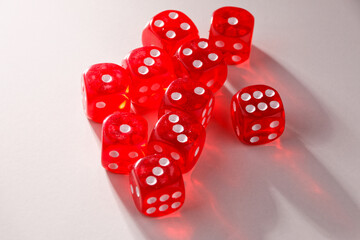 A random arrangement of dice and a puzzle cup, captured after the dice have been cast.
