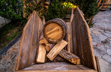 a wooden barrel with firewood in the cart.