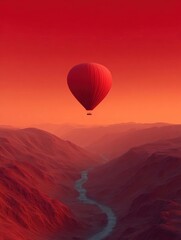Fototapeta premium Hot air balloon flying over a mountainous landscape. the balloon is in the center of the image, with its body facing towards the right side of the frame.