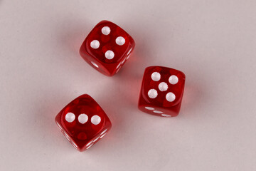 A random arrangement of dice and a puzzle cup, captured after the dice have been cast.