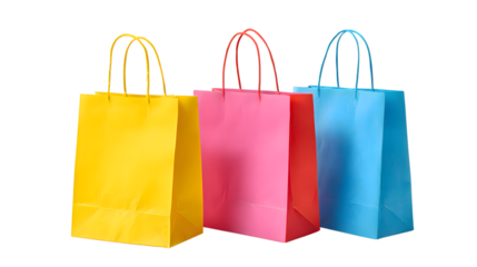 Three colorful paper shopping bags in yellow, pink, and blue stand upright, isolated on transparent background, ready for retail therapy