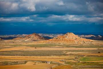 dark sky with landscape in sunlight