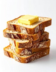 A stack of delicious, swirled bread slices topped with a rich pat of butter, perfect for breakfast or a snack.