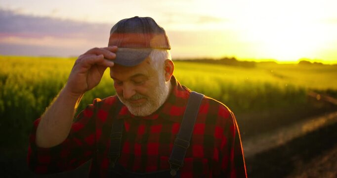 Exhausted Farm Worker Standing In Picturesque Farmland, Portrait Of Aged Male Person In Nature