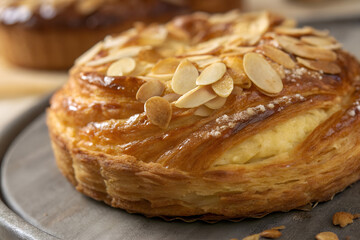 Almond Topped Danish Pastry with Flaky Layers and Sweet Glaze
