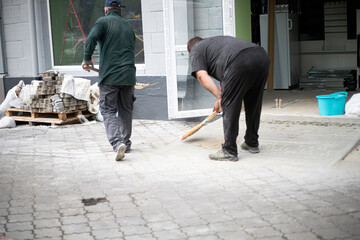clean up construction waste after laying paving slabs