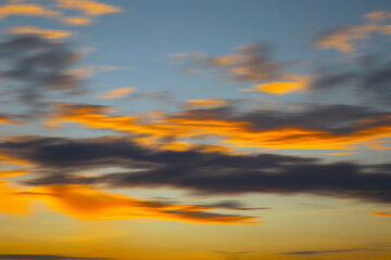 Fototapeta premium A beautiful blurred sunset background with soft, warm hues blending together. Perfect for natural background.