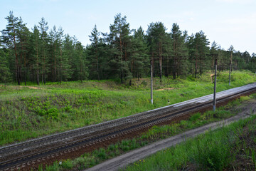 Fototapeta premium Railroad Tracks Through Forest A Scenic View from top
