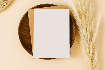 Blank Card Mockup, greeting card mockup with Envelope on Wooden Plate and Pampas Grass