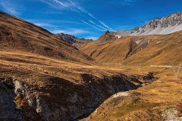 autumnal mountain landscape inside the Stelvio National Park along the Lombard side, Sondrio, Italy