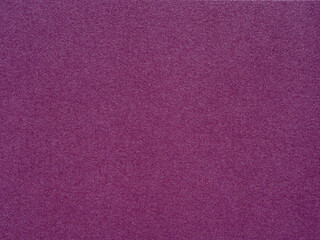 A vibrant spread of magenta, the textured paper pulses with life and the spirit of creative expression