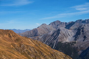 Fototapeta premium autumnal mountain landscape inside the Stelvio National Park along the Lombard side, Sondrio, Italy