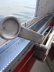 detail of a boat close-up against the background of water