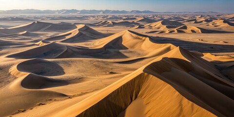 Expansive golden sand dunes under the clear blue sky in the vast desert landscape during sunset Generative AI